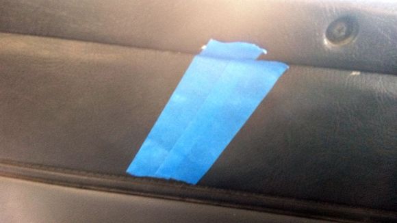 repair begun has to sit 24 hrs for the adhesive to set an hold the torn parts i put the tape on to make sure it stays stuck to the cloth an is flat tomorrow i work with color vinyl an grain paper