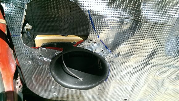 MDF Ring and baffle installed with coated deck screws.  You can see the blue sharpie swoop of the window crank and the door hinge stop at the top left (as well as the interior sound deadening)