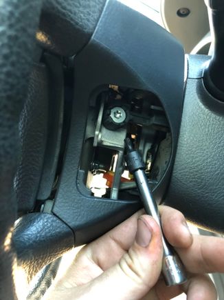 loosen the two torque head screws on either side of the wheel, this will allow removal of the airbag.  