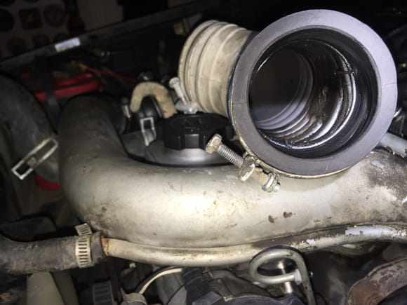 Air Intake Hose w/oil residue from the CT20 Turbo. Note the wire at about the 3'oclock position keeping the hose together. The previous owner wired it together and sealed it with duct tape.
