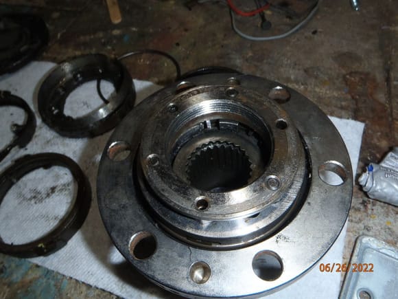 with the wheel bearing retainer nut, flat side toward the bearings...