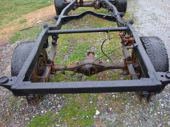 The new square tubing added and factory cross support / spare tire mount removed. The new fuel cell should fit nicely in there.