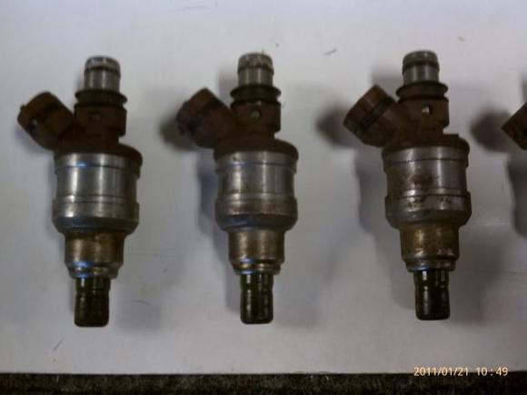 Fuel injectors before cleaning.  4-6 of 6