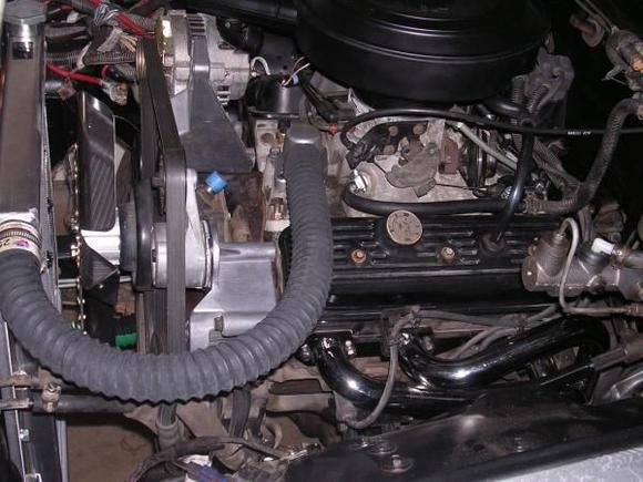 I used a 15" flex fan w/spacer kit. I would rather have used an electric puller but lacked the 4 1/4" needed to clear it because I wanted the transfer case to stay in the stock location.
