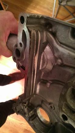 Worn through timing chain cover.  The scary thing is that I didn't have a dual row chain....the two very different distinct wear lines are from the thrust bearings coming out and the crank had 1/4" of play front to back in it!  That's what ultimately trashed the block.