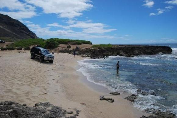 friend in the water, wishin he was fishin.. (notice the jeeps in the back behind the rocks... loosers...) lol