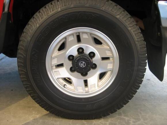 my wheelz  10x31.5 R15  Toyo Open Country A/T.  I like 'em cuz they are relatively quiet at highway speeds, they don't kick up a lot of rocks, and they're decent in the mud &amp; snow.  They last about 60-70K miles.  I use 35psi in the fronts, 37-38psi in the rear.

Oh and for the polished rims?  Mothers mag cleaner.  A small flatblade eyeglass screwdriver and piece of terrycloth gets into those hard-to-reach crevices.

Note the black plastic center caps on the rear tires have no writing on them.  The front caps do!
