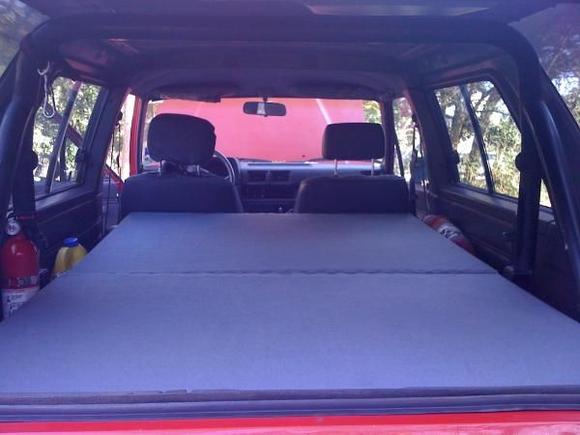 the two sections can be stacked on top of each other in the back so that I can fold the seats back up. (with the seats folded down I just remove the two seats on the front section so it just rests on top of the seats)