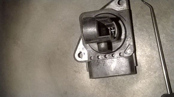 This is a clean MAF. Try using a pick tool very carefully, that's what I had to do.

New upstream sensor usually fixes other issues like the title subject. 

Plugs look good.