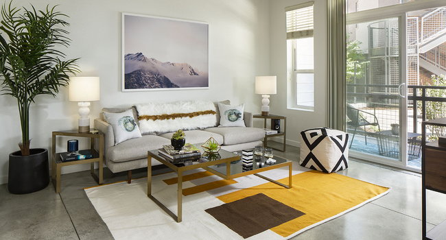 Apartment Living Room with polished concrete floors and patio.